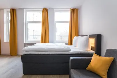 Ein Bett oder Betten in einem Zimmer der Unterkunft Homaris Boxi Studios