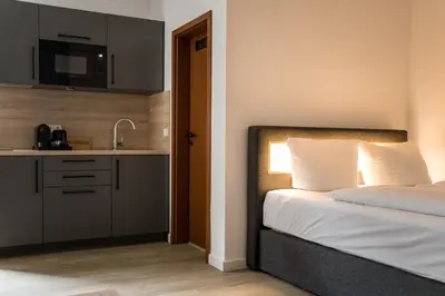 Ein Bett oder Betten in einem Zimmer der Unterkunft Homaris Boxi Studios