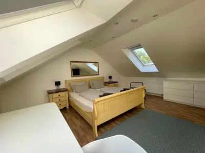 Ein Bett oder Betten in einem Zimmer der Unterkunft Westendperle am Olympiastadion
