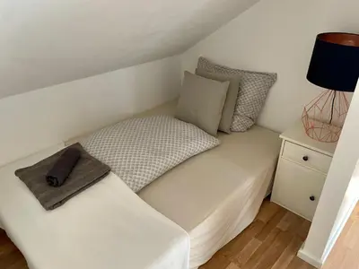 Ein Bett oder Betten in einem Zimmer der Unterkunft Westendperle am Olympiastadion