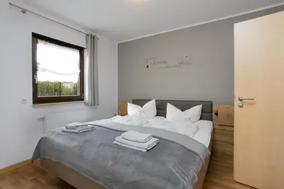 Ein Bett oder Betten in einem Zimmer der Unterkunft Am Wiesengrund