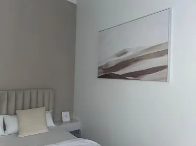Ein Bett oder Betten in einem Zimmer der Unterkunft Luxuriöses Studio mit privatem Zugang zum See