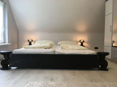 Ein Bett oder Betten in einem Zimmer der Unterkunft -Haus am Wäldchen-