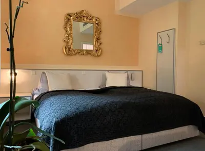 Ein Bett oder Betten in einem Zimmer der Unterkunft Hotel Blaufuchs