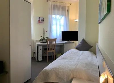 Ein Bett oder Betten in einem Zimmer der Unterkunft Hotel Blaufuchs