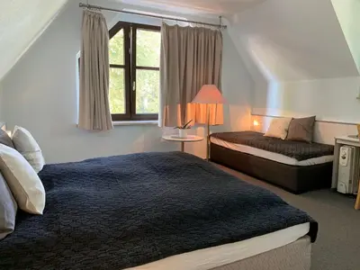 Ein Bett oder Betten in einem Zimmer der Unterkunft Hotel Blaufuchs