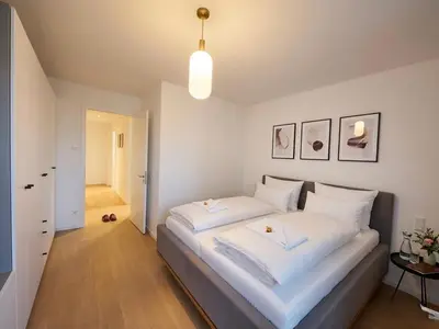 Ein Bett oder Betten in einem Zimmer der Unterkunft Nova Sky