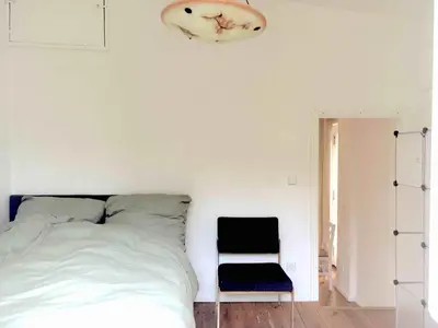 Ein Bett oder Betten in einem Zimmer der Unterkunft Gartenhaus mit Sauna am Buckowsee, Märkische Schweiz