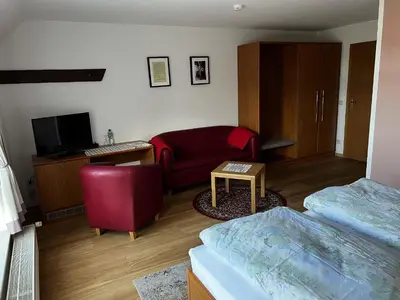 Ein Bett oder Betten in einem Zimmer der Unterkunft Pension Zur Mühle