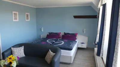 Ein Sitzbereich in der Unterkunft Pension Zur Mühle