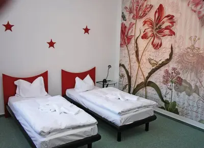 Ein Bett oder Betten in einem Zimmer der Unterkunft Hotel-Sternthaler /Rathauseck