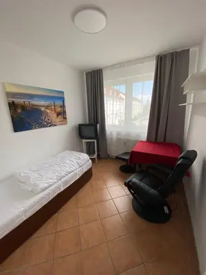 Ein Bett oder Betten in einem Zimmer der Unterkunft Hotel-Sternthaler /Rathauseck