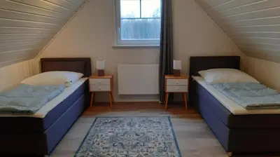 Ein Bett oder Betten in einem Zimmer der Unterkunft Ferienhaus 'Elly'