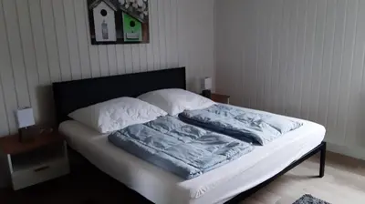 Ein Bett oder Betten in einem Zimmer der Unterkunft Ferienhaus 'Elly'