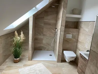 Ein Badezimmer in der Unterkunft Gästesuite „Torfstich“