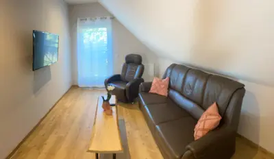 Ein Sitzbereich in der Unterkunft Gästesuite „Torfstich“