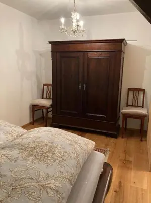 Ein Bett oder Betten in einem Zimmer der Unterkunft Dorfstübchen