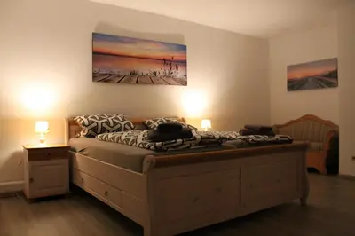 Ein Bett oder Betten in einem Zimmer der Unterkunft Villa Landidyll mit wunderschönem-seperatem Wellnessbereich