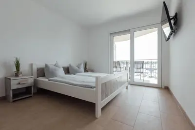 Ein Bett oder Betten in einem Zimmer der Unterkunft Exklusive Ferienwohnungen an der Havel