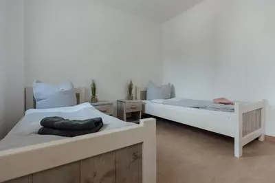 Ein Bett oder Betten in einem Zimmer der Unterkunft Exklusive Ferienwohnungen an der Havel