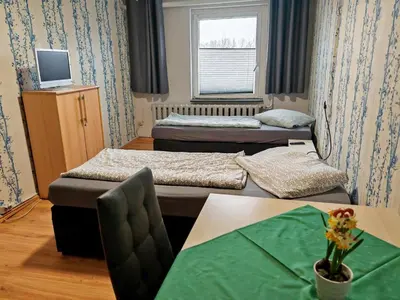 Ein Bett oder Betten in einem Zimmer der Unterkunft Jeamais Pension