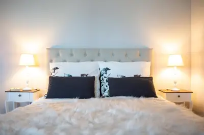 Ein Bett oder Betten in einem Zimmer der Unterkunft Gästehaus Landglück