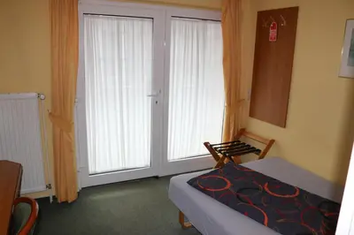 Ein Sitzbereich in der Unterkunft Stadthotel Brandenburger Hof