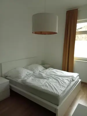Ein Bett oder Betten in einem Zimmer der Unterkunft Stadtgrün 2, Ruhiges Apartment mit Terrasse und kostenlosem Parkplatz, ideal für Berlin-Besucher