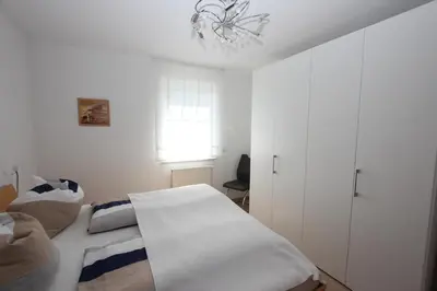 Ein Bett oder Betten in einem Zimmer der Unterkunft K8 FeWo - Am Kurpark - Therme