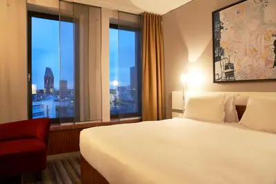 Ein Bett oder Betten in einem Zimmer der Unterkunft Dorint Kurfürstendamm Berlin
