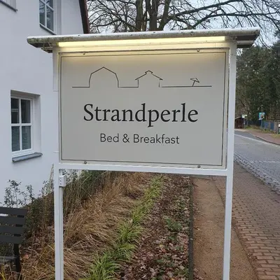 Ein Zertifikat, Auszeichnung, Logo oder anderes Dokument, das in der Unterkunft Strandperle ausgestellt ist