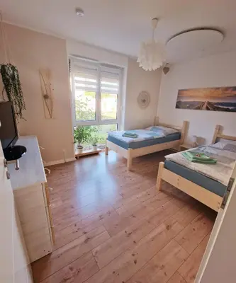Ein Bett oder Betten in einem Zimmer der Unterkunft Ferienwohnung Sunny 1
