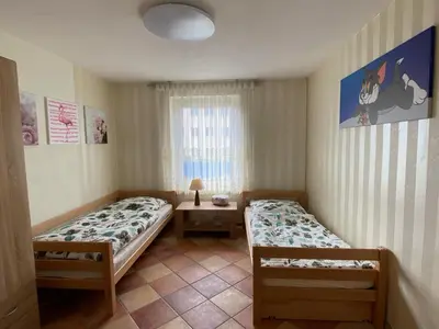 Ein Bett oder Betten in einem Zimmer der Unterkunft Haus Springpfuhl mit Wintergarten