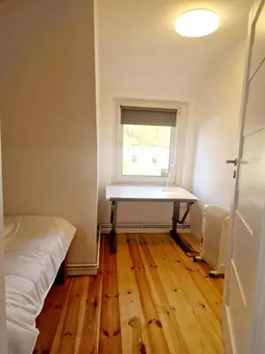 Ein Bett oder Betten in einem Zimmer der Unterkunft Apartment with parking in Berlin 11