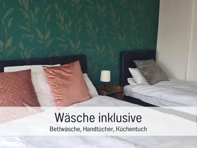 Ein Bett oder Betten in einem Zimmer der Unterkunft Stadtapartment by LivE it - voll ausgestattete Küche, SmartTV, Waschtrockner, 1-5 Pers